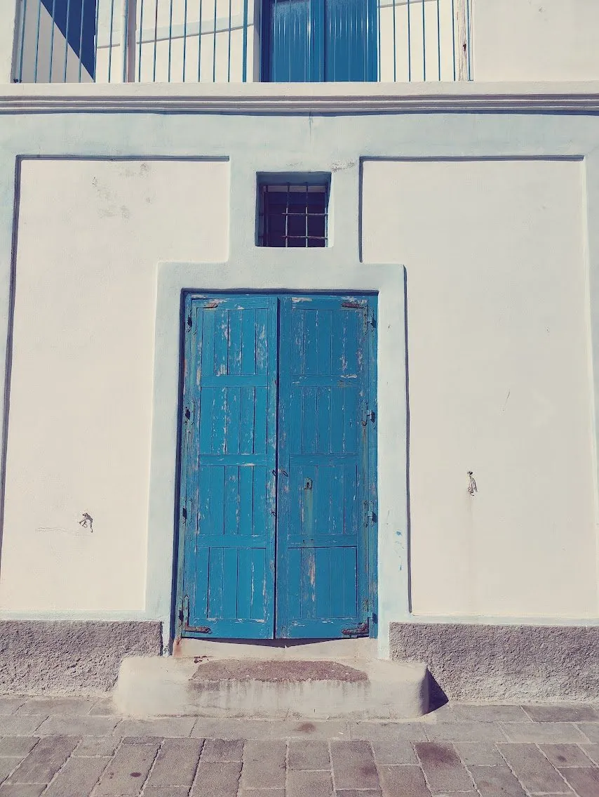 A blue door on an Aeolian house, met while walking the islands